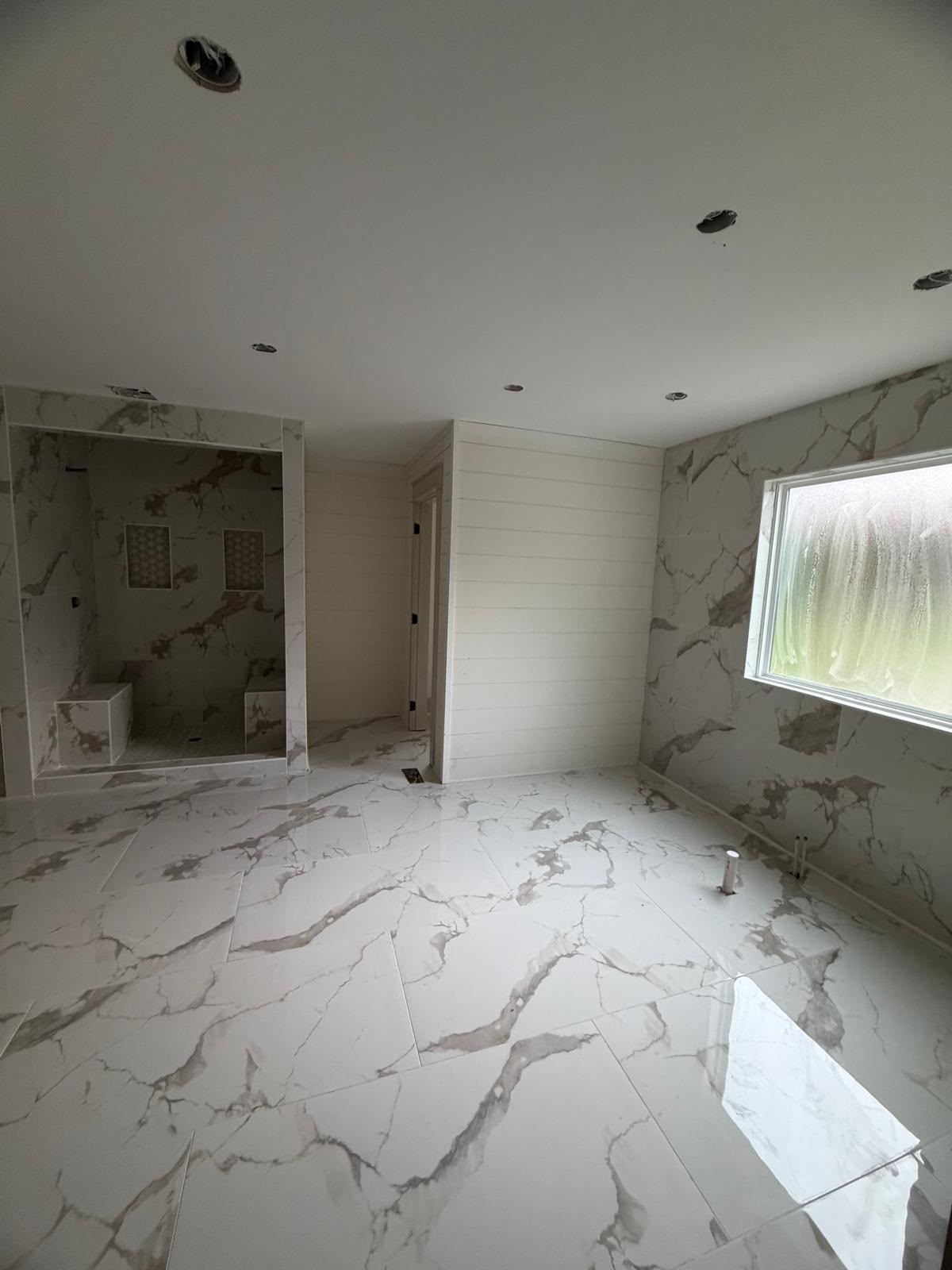 Marble-look porcelain tile in a bathroom